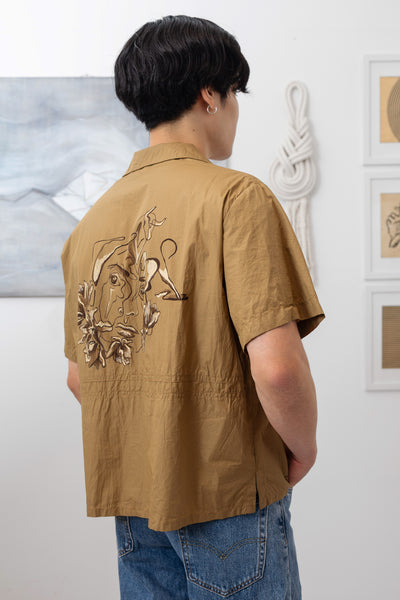 Back close up view of bowling men's shirt with hand painted motifs and side slits by nowhere studio