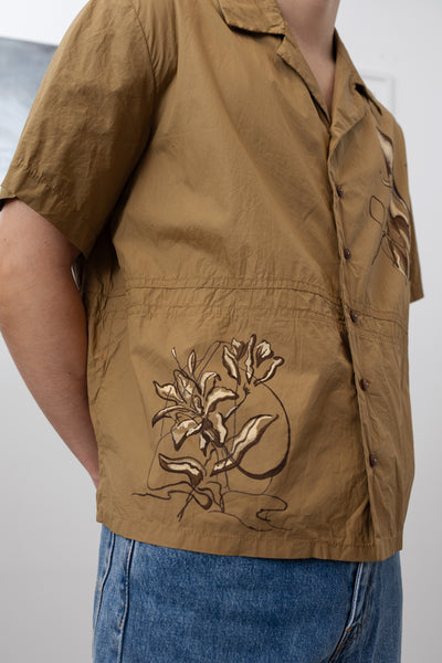Detail side view of bowling men's shirt with hand painted floral motifs and stylized seams by nowhere studio