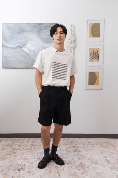 Full front view of white printed menswear  shirt with logo embroidered graphic and invisible zipper by nowhere studio
