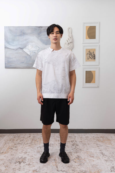 Full front view of white printed short sleeve menswear shirt with trompe l'oeil print and invisible zipper by nowhere studio