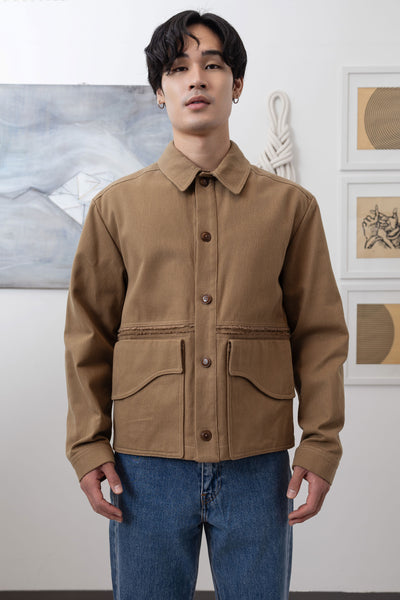 Earth workwear jacket close-up front, Corozo buttons and sculptural curved pocket flap by nowhere studio