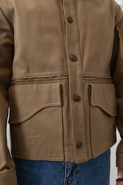 Earth workwear jacket front detail two, curved pocket flap on brushed bull denim by nowhere studio