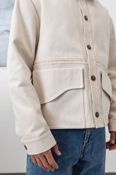 Ivory workwear jacket front detail, selvedge fringe and utilitarian pockets by nowhere studio