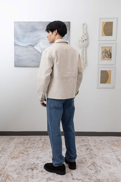 Ivory workwear jacket full back left view, reinforced seams and structured silhouette by nowhere studio