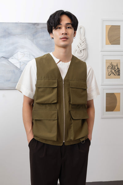 Close-up front detail of fisherman's vest in Army mid-weight twill with double-needle topstitching and zipper closure by nowhere studio