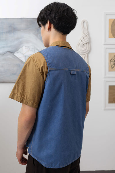 Close-up back left detail of fisherman's vest in Denim mid-weight twill with double-needle topstitching and D-ring hardware by nowhere studio