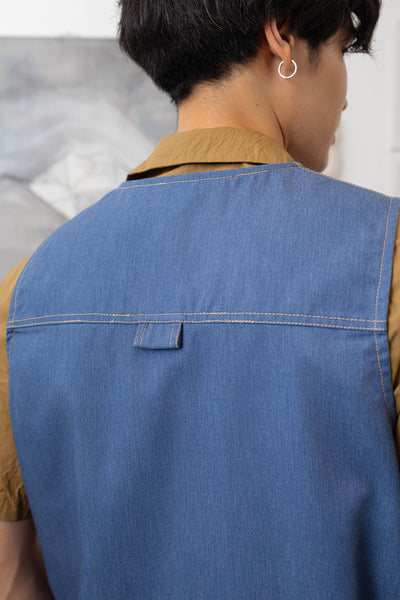 Back detail of fisherman's vest in Denim mid-weight twill with double-needle topstitching and D-ring hardware by nowhere studio