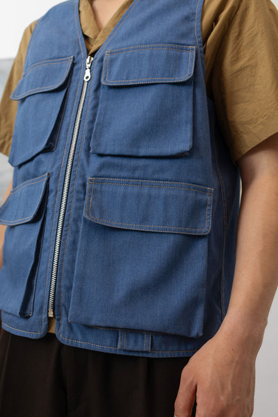 Front detail view of fisherman's vest in Denim mid-weight twill with 3D cargo pocket and zipper closure by nowhere studio