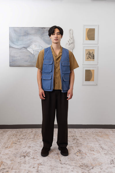 Full front view of fisherman's vest in Denim mid-weight twill with 3D cargo pockets and D-rings by nowhere studio