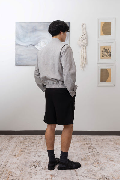 Full back right view of Granite Harrington jacket with back vent construction for ease of movement by nowhere studio