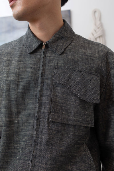 Yarn dye navy Harrington jacket front detail, cargo pocket with organic curve flap and metal zipper by nowhere studio