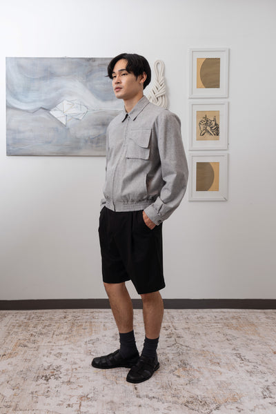 Full left side view of Granite Harrington jacket  with elasticized waistband and cargo pocket by nowhere studio