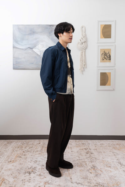 Navy Harrington jacket full right side view, water-resistant nylon workwear silhouette by nowhere studio
