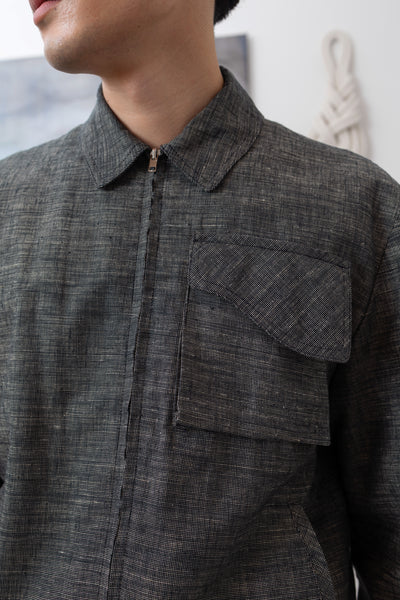 Yarn dye navy Harrington jacket front detail, cargo pocket with organic curve flap and metal zipper by nowhere studio