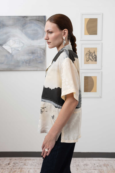 Close-up left side view of studio shirt in vintage printed fabric — seam detail and fluid drape, nowhere studio