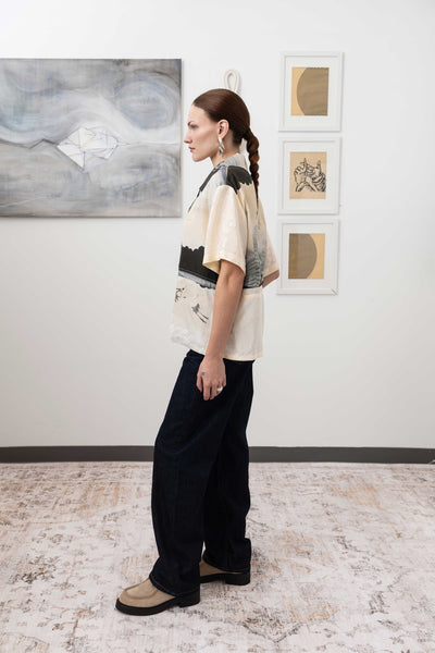 Full left side view of studio shirt in vintage printed fabric with side slits by nowhere studio