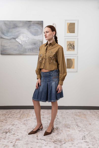 Hand painted artisanal blouse in tan, profile view — artisanal painted detail with softly gathered sleeves, nowhere studio