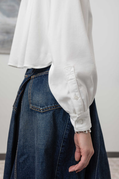 Sleeve detail of artisanal blouse in white — softly gathered volume in Tencel twill with elastane, nowhere studio