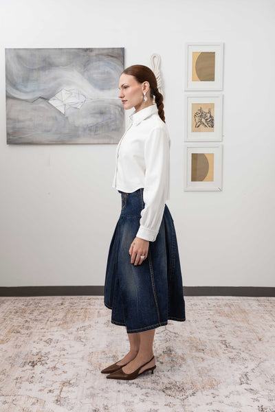 Artisanal blouse in white, left side view — cropped length with gently curved hem in Tencel twill, nowhere studio