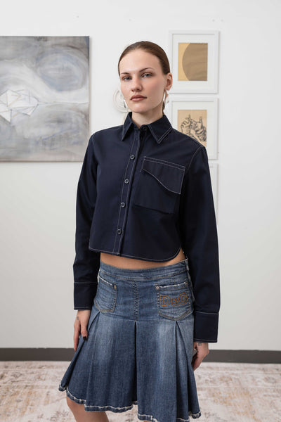 Close-up front view of utilitarian shirt in Admiral — shrunken silhouette with contrast double-needle topstitching, nowhere studio