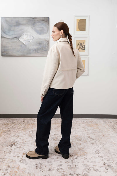 Workwear jacket in ivory, full back left view — selvedge fringe panel with reinforced seam construction, nowhere studio