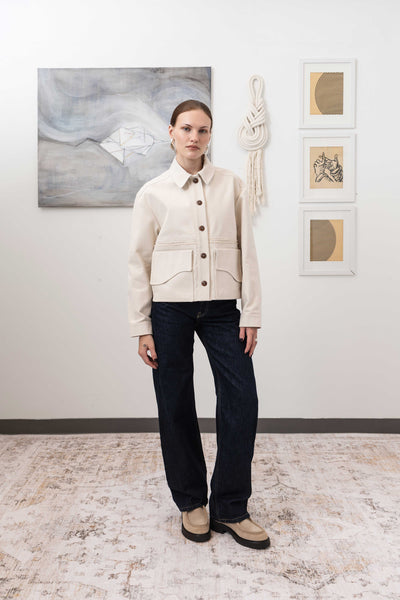Workwear jacket in ivory, full front alternate view — dual-entry pockets and curved flap in artisanal workwear construction, nowhere studio