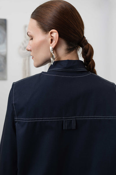 Close-up back detail of fisherman's vest in Admiral mid-weight twill with topstitching and utilitatian tab by nowhere studio