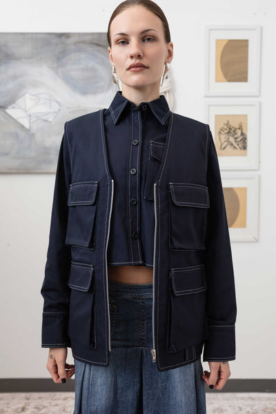 Close-up front alternate detail of fisherman's vest in Admiral mid-weight twill with zipper closure and cargo pockets by nowhere studio