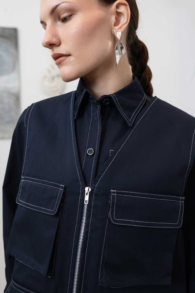 Close-up front view of fisherman's vest in Admiral mid-weight twill with double-needle topstitching and zipper closure by nowhere studio