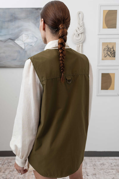 Close-up back detail of fisherman's vest in Army mid-weight twill with topstitching and structured hem by nowhere studio