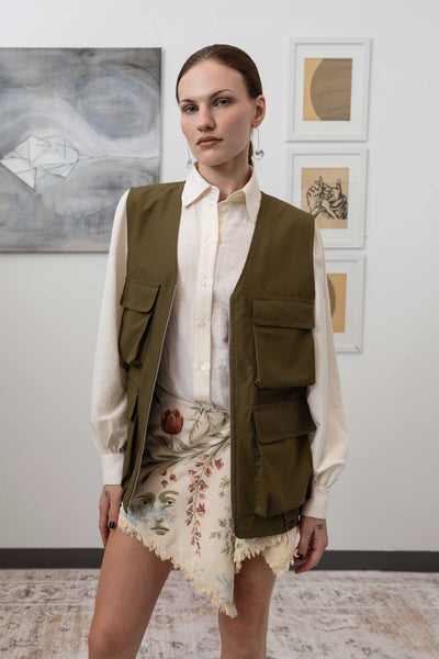 Close-up front view of fisherman's vest in Army mid-weight twill with zipper closure and cargo pocket detail by nowhere studio