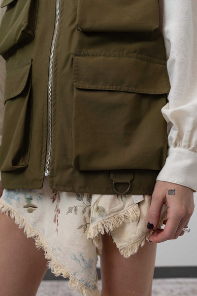 Left side detail of fisherman's vest in Army mid-weight twill — D-ring and cargo pocket hardware, nowhere studio