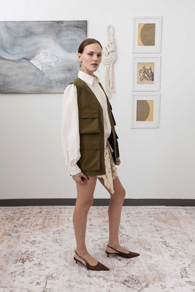 Full right side view of fisherman's vest in Army mid-weight twill with utilitarian pocket placement by nowhere studio