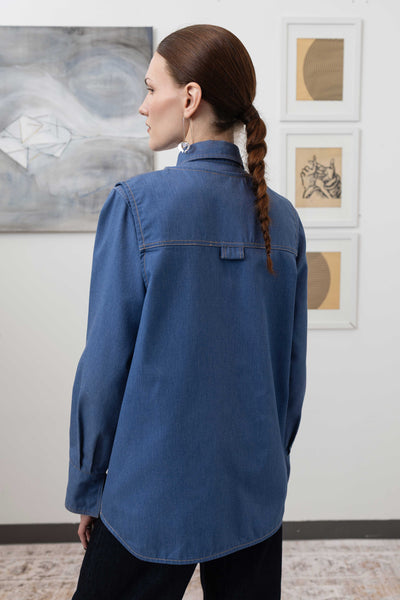 Close-up back left detail of fisherman's vest in Denim mid-weight twill with topstitching and structured hem by nowhere studio