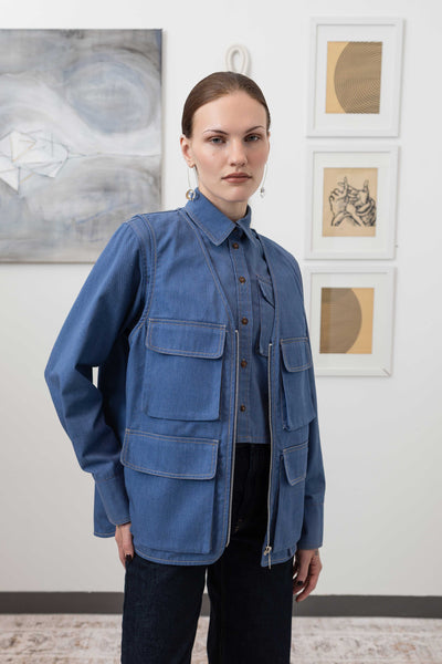 Close-up right front detail of fisherman's vest in Denim mid-weight twill with zipper closure and cargo pocket by nowhere studio