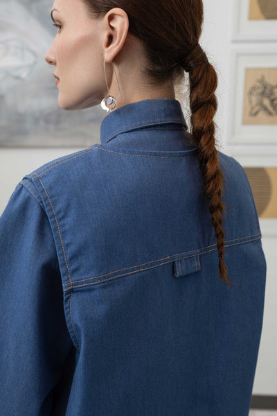Back detail of fisherman's vest in Denim mid-weight twill — double-needle topstitching and utility details, nowhere studio