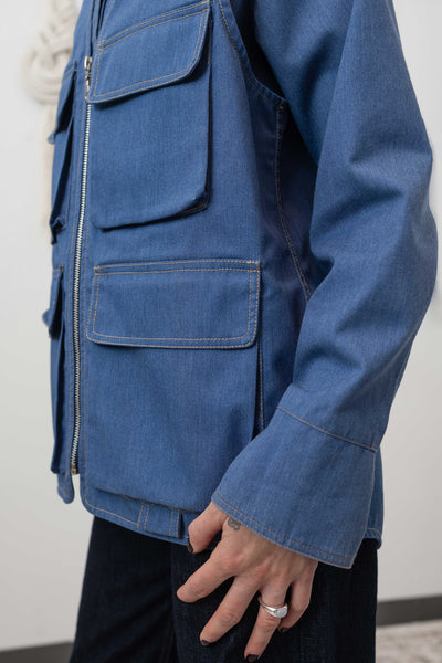 Side detail of fisherman's vest in Denim mid-weight twill — D-ring tab and cargo pocket hardware, nowhere studio