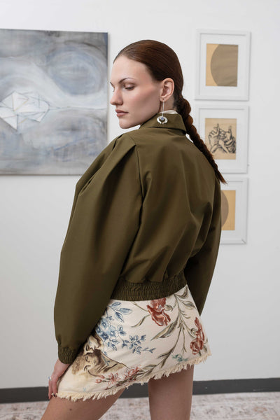 Close-up back left detail of sculptural blouson jacket in army with pleated sleeves  in deadstock Italian mill nylon, nowhere studio