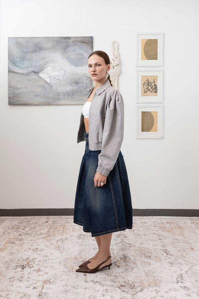 Sculptural blouson jacket in granite, left side view — gathered waist with pleated sleeve volume in natural canvas, nowhere studio