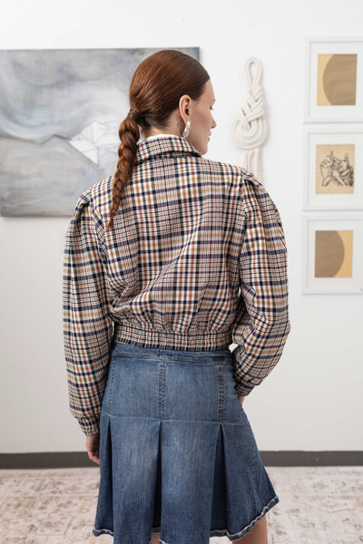 Close-up back detail of sculptural blouson jacket in yarn-dye plaid — elasticized hem and twill construction, nowhere studio