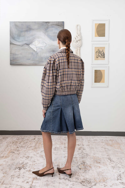 Sculptural blouson jacket in yarn-dye plaid, full back left view — modernist sculptural form with welt pockets and elasticized hem, nowhere studio