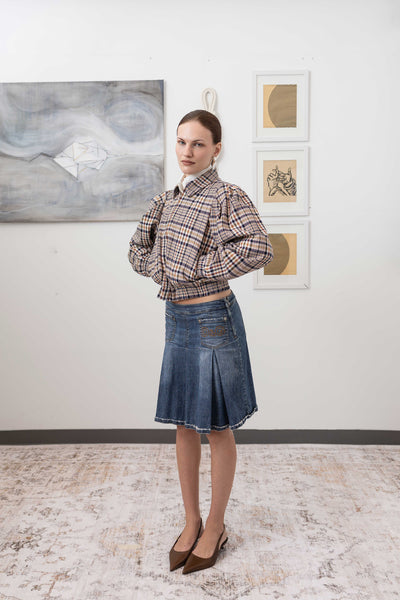 Sculptural blouson jacket in yarn-dye plaid, profile view — softened structure with depth of pattern and refined hand, nowhere studio